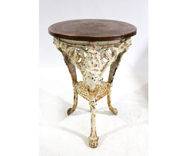 A Victorian cast iron Britannia table with pressed copper top 1