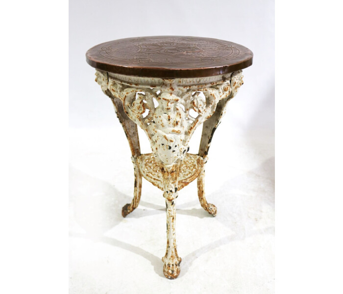 A Victorian cast iron Britannia table with pressed copper top 1