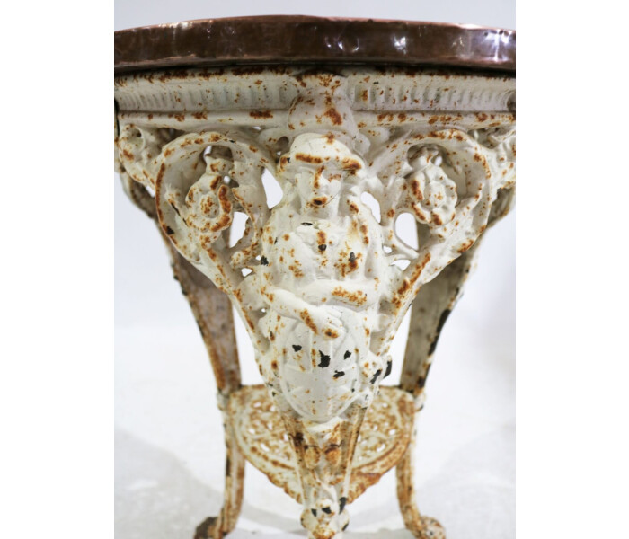 A Victorian cast iron Britannia table with pressed copper top 3