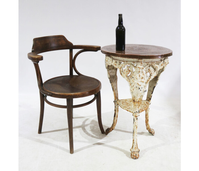 A Victorian cast iron Britannia table with pressed copper top 4